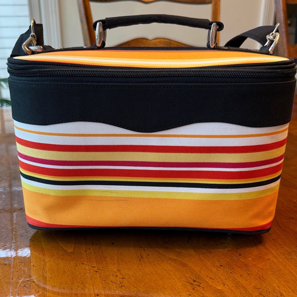 Striped Cosmetic Train Case with adjustable and detachable strap.